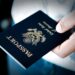Passport in hand Image of a persons hand holding a passport