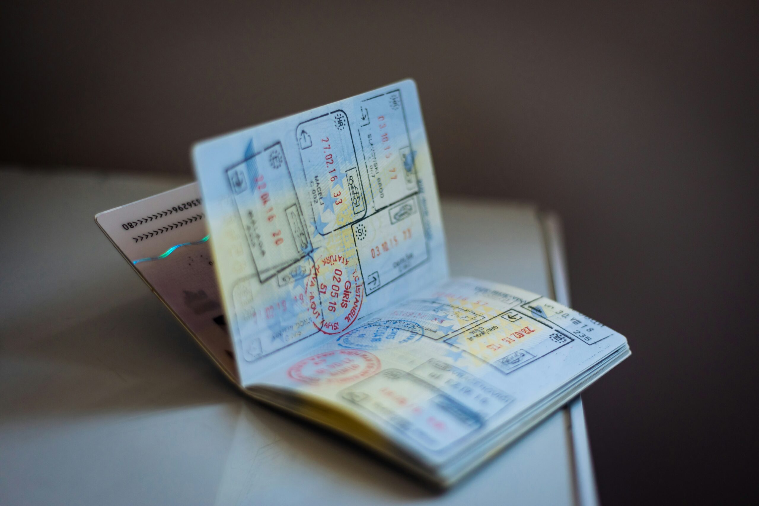 Passport pages filled with international visa stamps